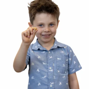 child holding blossom gum